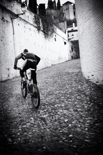 Bicyclist going uphill (3:2 aspect ratio) -- Granada, Spain (2016)